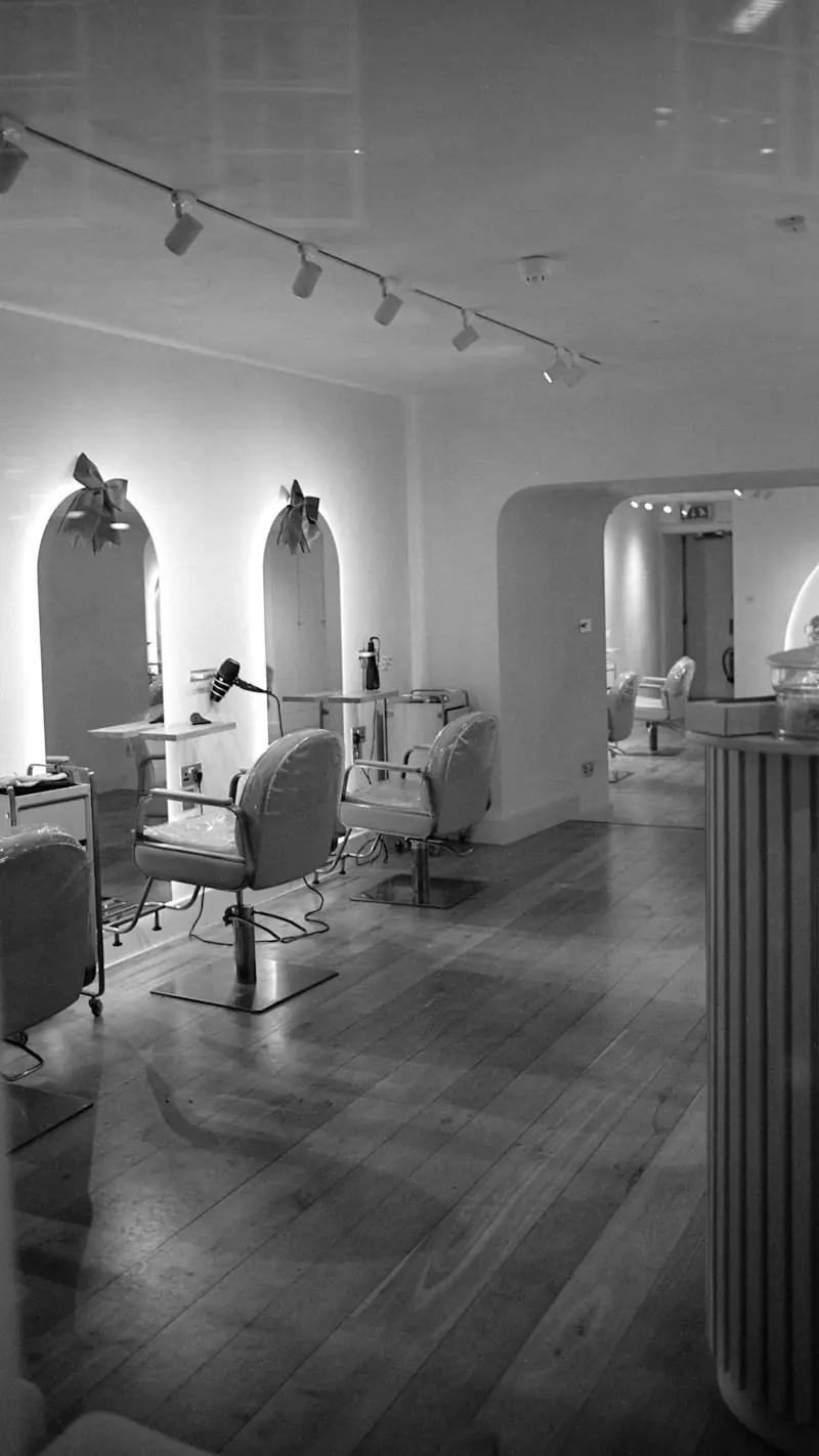 The salon interior, chairs and mirrors in a row.