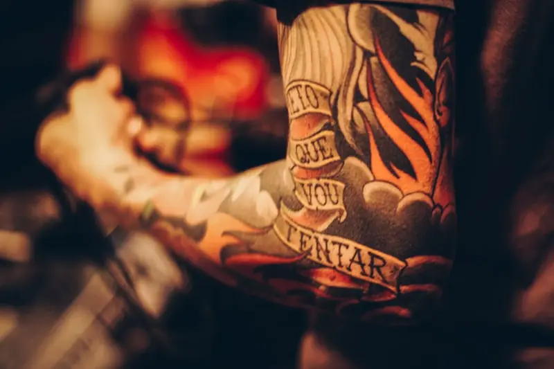 Close detail of line work on an arm.