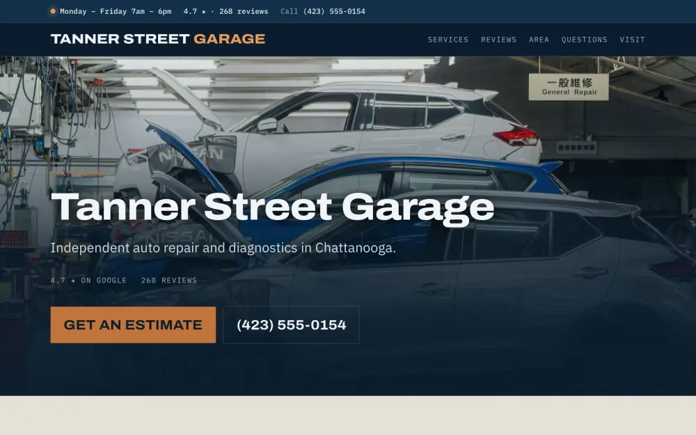 Home page of the Tanner Street Garage demo site. Cars up on lifts in a workshop bay.